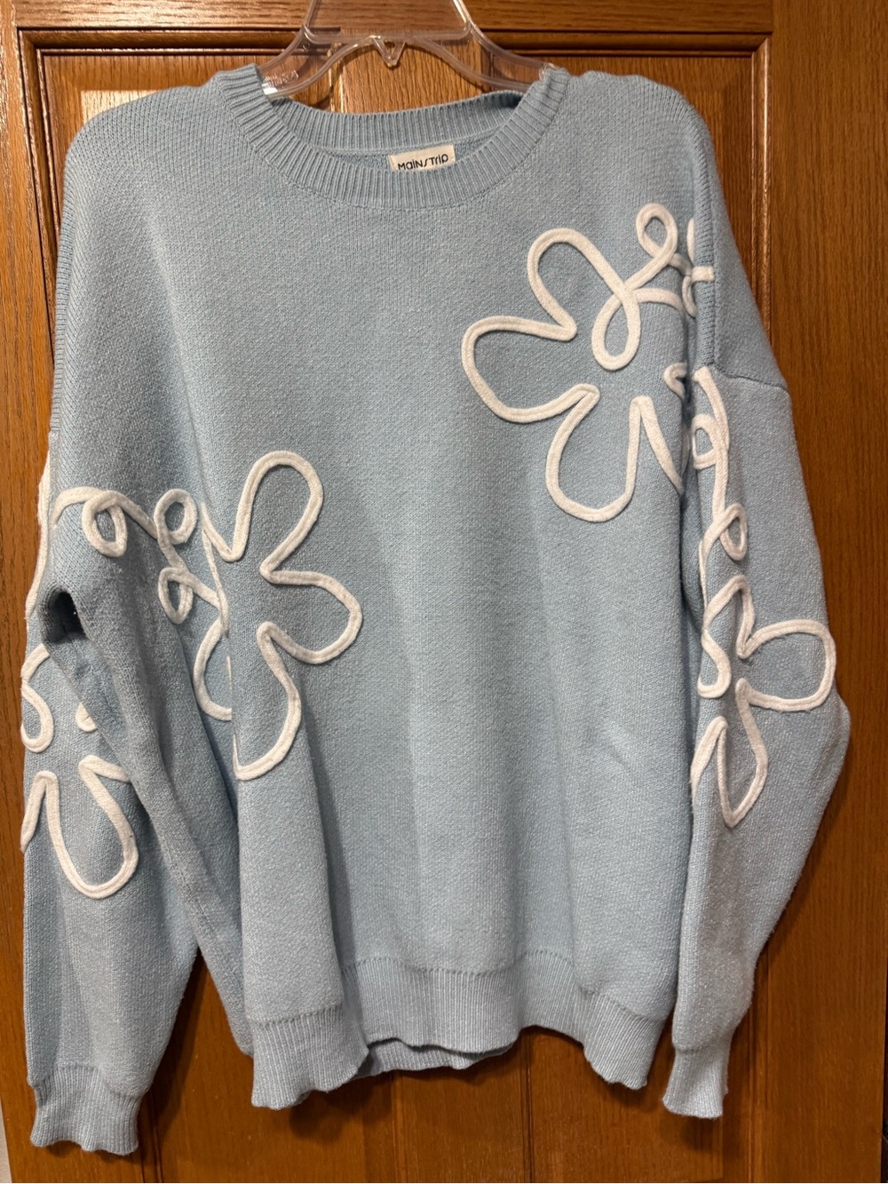 Main Strip Pale Blue Crewneck Sweater with White Floral Appliqué from Avara